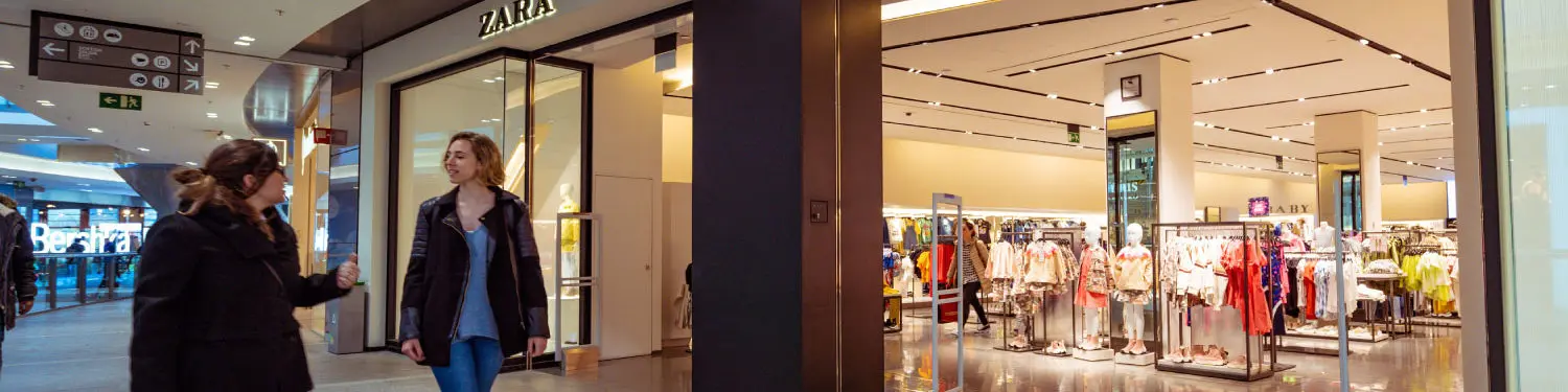 Shoppers outside clothing store