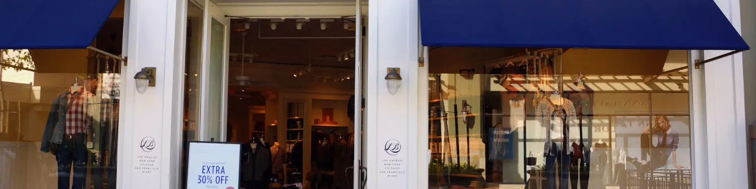 Fashion boutique with blue awnings